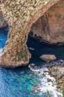 Malta. The Blue Grotto, seen from above. Small tour boat. Art Print